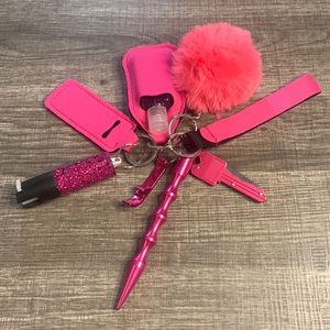 Pink Defensive Keychain with pepper spray attached